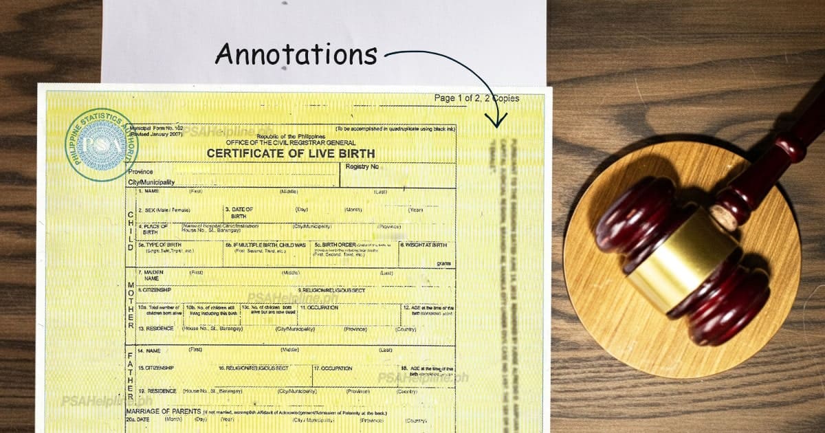 PSA Certificate of Live Birth on SECPA security paper with an arrow pointing to the Annotations section at the top of the document, shown alongside a judge's gavel