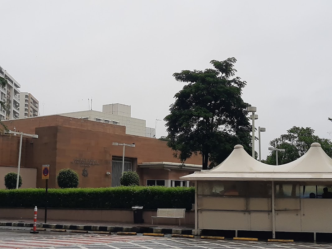 Consulate General of the United States of America exterior entrance, Bandra Kurla Complex, Mumbai, showing building signage and applicant waiting tent