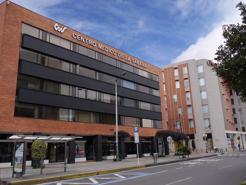 Centro Medico de la Sabana building facade with signage on Carrera 7, Bogota, where U.S. Embassy-designated panel physicians perform the immigrant visa medical exam